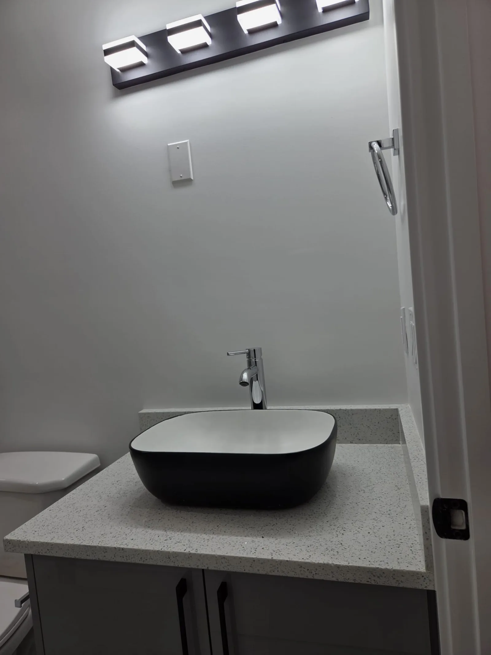 Interior of completed secondary suite showing open concept layout, Calgary