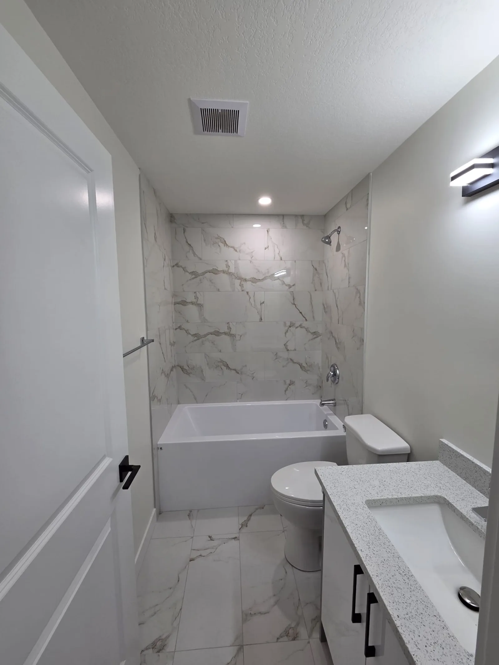 Luxury vinyl plank flooring installation in basement suite, Calgary